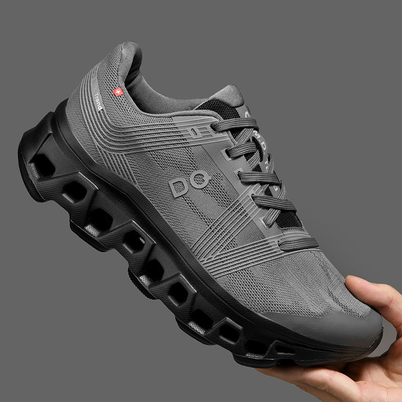 Trending Sneakers and Shoes Collection: grey athletic shoe held in hand against a gray background.
